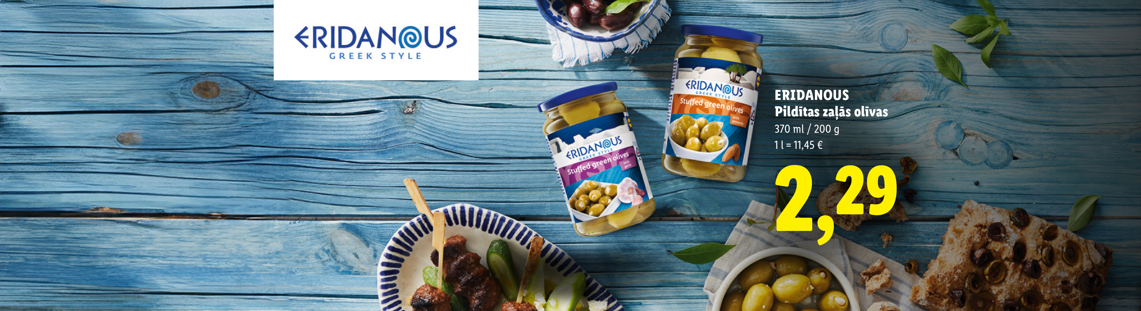 Burkas ar pildītām zaļajām olīvām uz zila koka fona, cena 2,29.